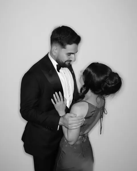 Couple embracing in a black and white Gold Booth portrait
