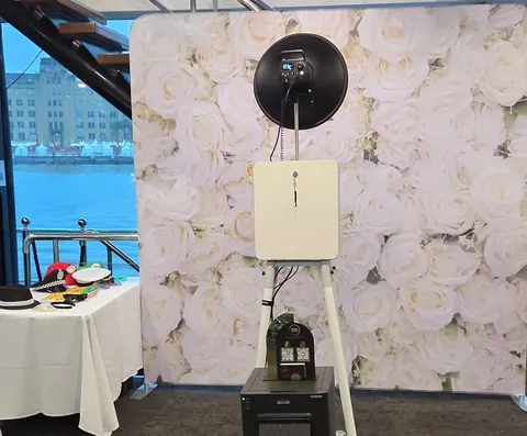 Open Air Photo Booth with a white floral backdrop