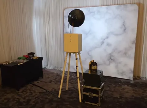 Open Air Photo Booth with a marble-patterned backdrop