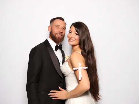 Bride and groom embracing at the waist